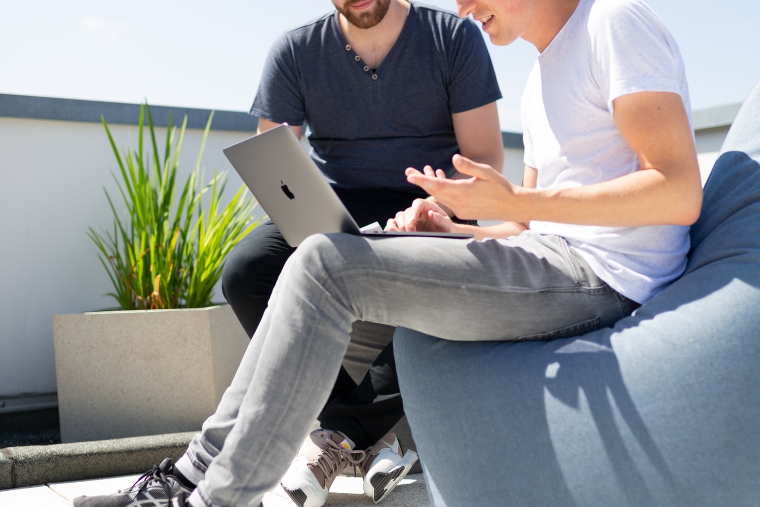 Two people looking at laptop