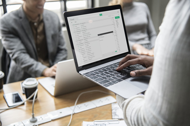 Man checking his email on laptop